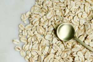 spoon sitting on top of uncooked rolled oats